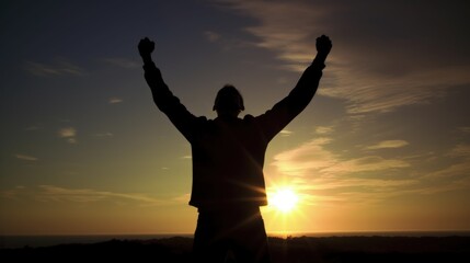 Fototapeta premium Silhouette of man raised hands at sunrise background, strong pose