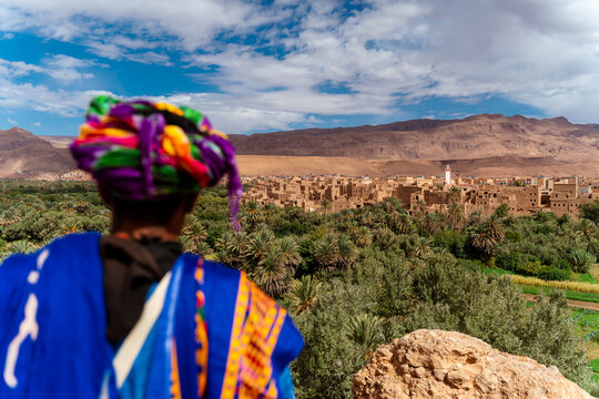 Moroccan man looks at Tingir city from a lookout