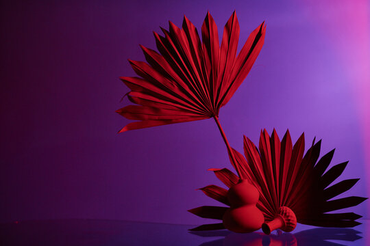 Vases with palm leaves