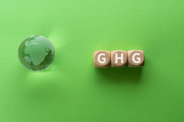 There is wood cubes with the word GHG. It is eye-catching image.