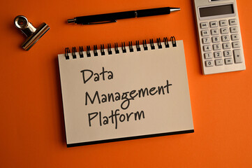 There is a notebook with the word Data Management Platform. It is eye-catching image.