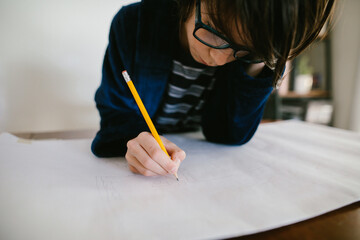 Boy does homework at home