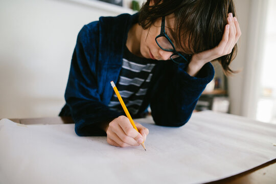 Boy does homework at home