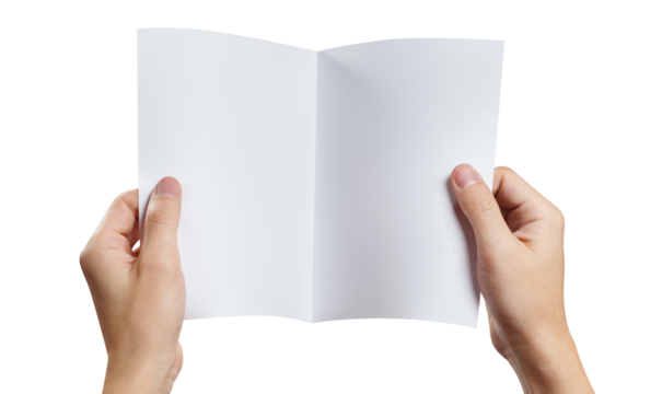 Hands holding a sheet of white paper with fold line in the middle, cut out