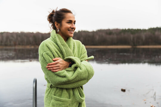 Woman having a breath after a cold swim in the lake