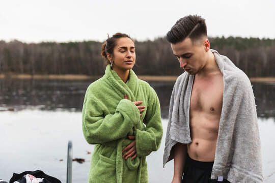 Friends having a breath after a cold swim in the lake