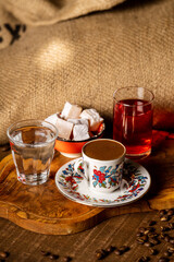 Coffee cup on a table with coffee beans
