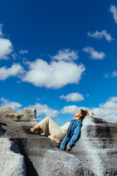 Woman lying on a rock