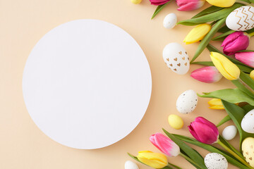 Naklejka na ściany i meble Easter mockup concept. Top view photo of white circle colorful easter eggs yellow pink tulips flowers on isolated beige background with blank space