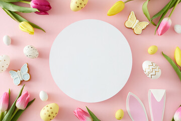 Naklejka na ściany i meble Easter idea. Top view composition of white circle colorful easter eggs rabbit bunny ears yellow pink tulips and butterfly cookies on pastel pink background with blank space