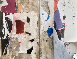 wall with torn posters