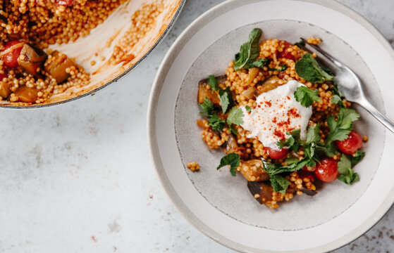 Pearl couscous with vegetables and paprika

