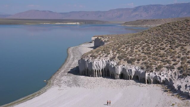 2022 - people walk near the Crowley Lake columns and tufa formations in the Easter Sierras of California.
