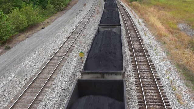 2022 - a long coal train rumbles through Virginia and West Virginia suggesting American coal towns.