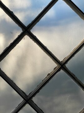 old window with light coming through 