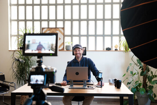 Smiling man streaming in live