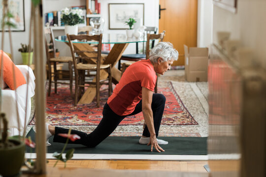 Woman Working Out In Living Room