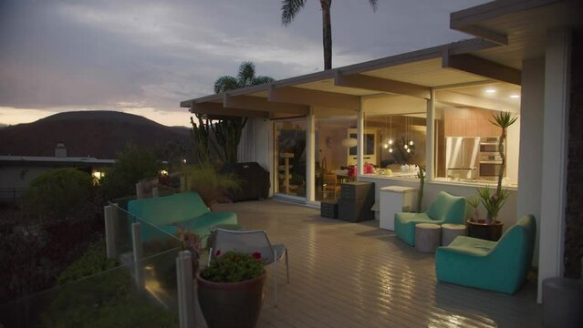 2022 - mid century moden home on the hillside of Los Angeles after the rain at dusk.