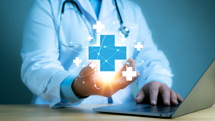 A medical worker holding medical cross shape and healthcare, Virus pandemic develop people awareness and spread attention on their healthcare in global.