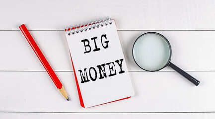 BIG MONEY text on notebook on white wooden background , business concept