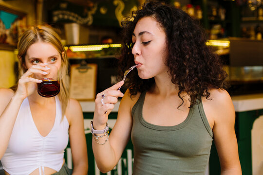 Women eating and drinking in a bar