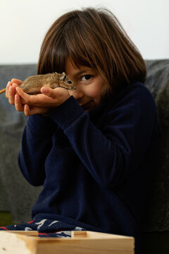 young girl and gerbil