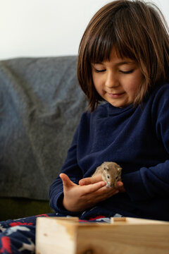 little girl holding her pet
