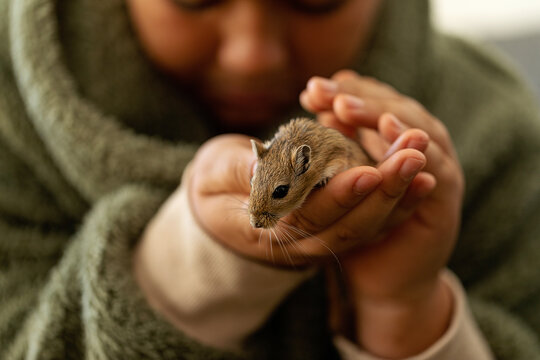 kid holding little pet