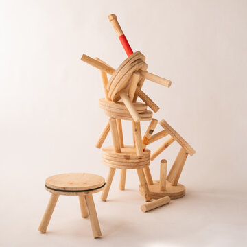 Image of Wooden Chairs Stacked One On To Another 