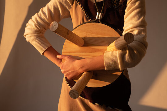 Cropped Image of Female Designer Holding Designed Wooden Stool