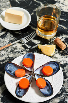 Bottle caps and tins on plate near butter and fork