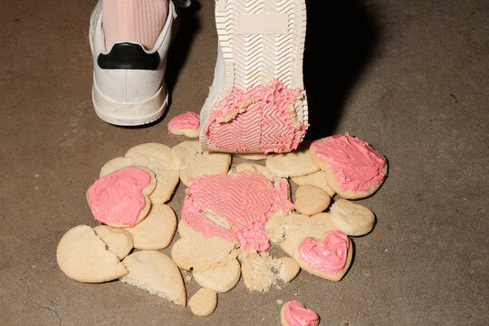 Heart shaped cookies crushed under foot