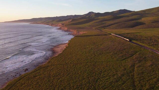 2023 - Excellent aerial footage of an Amtrak train traveling parallel to Jalama Beach, California.