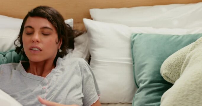 Lesbian couple, fight and argue while tired in bed with unhappy relationship or marriage with angry communication in bedroom. Stress of lgbt women tired and frustrated in conflict conversation