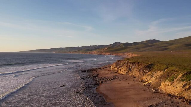 2023 - Excellent aerial footage of waves lapping the rocky shores of Jalama Beach, California.