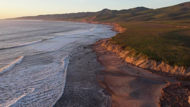 2023 - Excellent aerial footage of waves lapping the shores of Jalama Beach, California.
