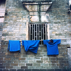 Drying clothes on the wall of ancient buildings