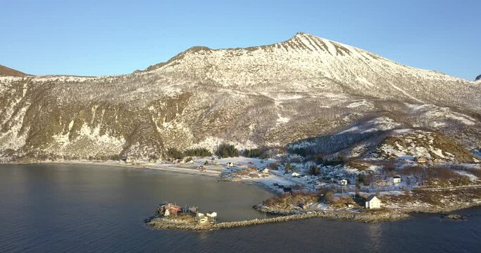 Relaxing and stunning aerial footage by drone over a fiord in north Norway during winter season
