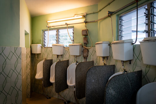 Old fashioned urinals at a public restroom in Kolkata, India