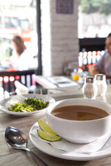 Broth with lime in restaurant
