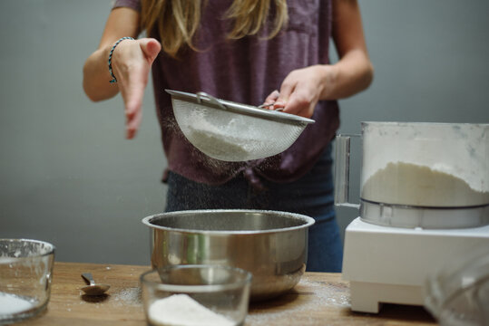 Girl's hands sifting