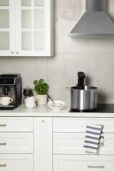 Pot with sous vide cooker in kitchen. Thermal immersion circulator