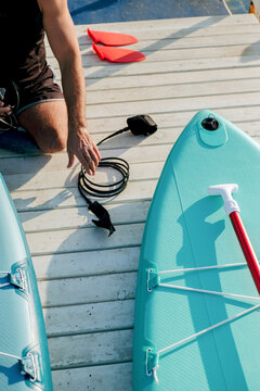 Disabled man with no legs prepares to ride the SUP board