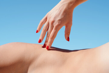 Feminine hand with red nails