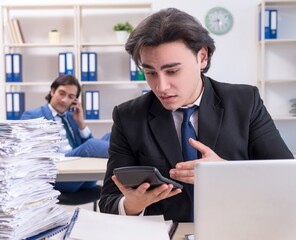 Two male colleagues unhappy with excessive work