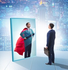 Businessman seeing himself in mirror as superhero