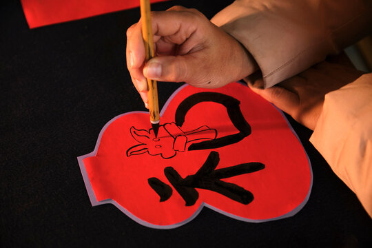 Make traditional Chinese New Year brush calligraphy decorations