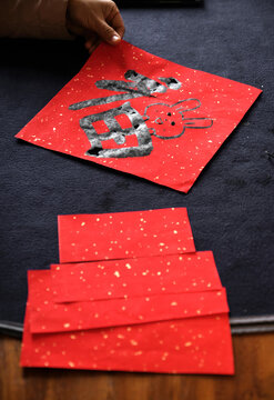 Make traditional Chinese New Year brush calligraphy decorations
