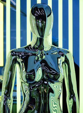 Futuristic robotic human figure made from metal with neon light 
