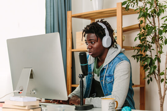 Podcaster chats into mic